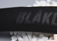 Webbing πολυεστέρα λογότυπων συνήθειας ενδυμάτων τα λουριά αποτύπωσαν το Μαύρο 35mm σε ανάγλυφο
